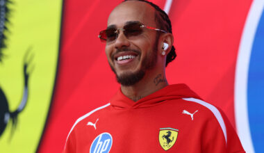 Ferrari driver Lewis Hamilton (44) smiling in Ferrari hoodie