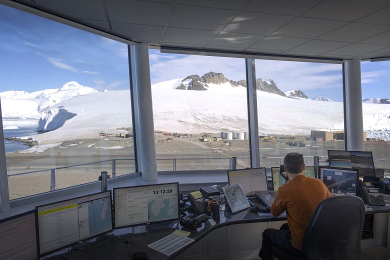 A control tower rises above the roof line, providing 360-degree views of the station's runway and wharf.