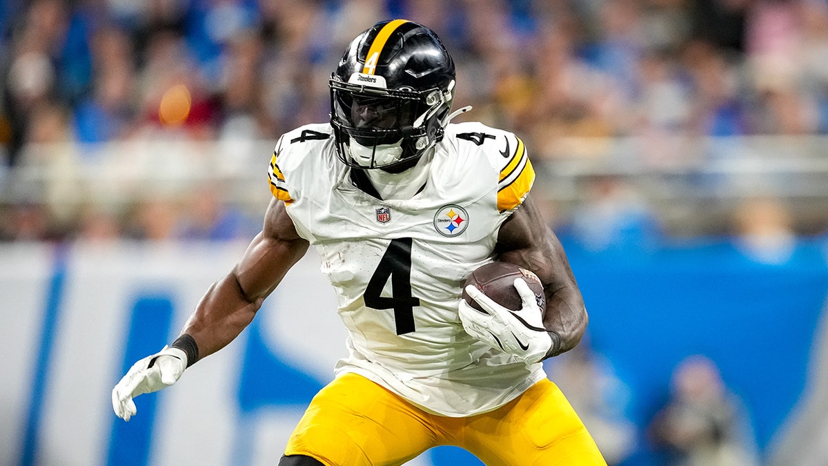 DK Metcalf of the Pittsburgh Steelers running with the football during a game at Ford Field
