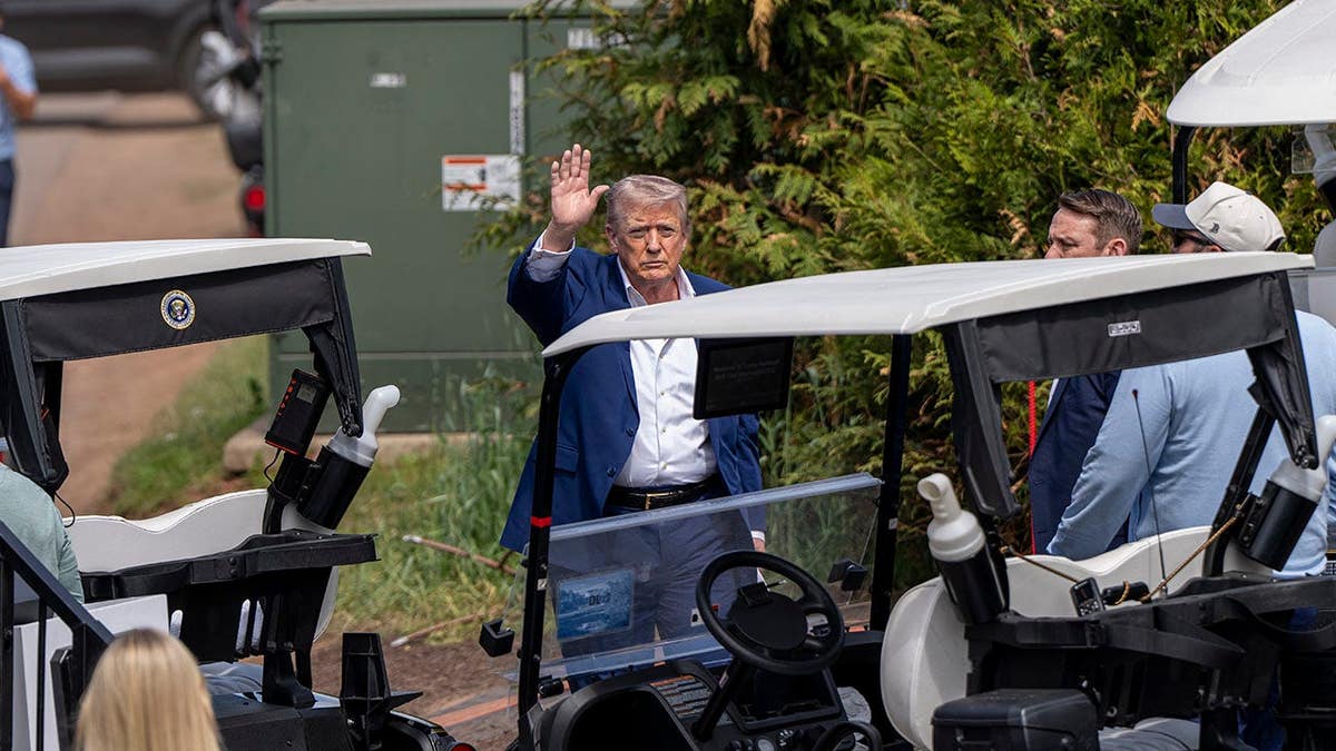 President Donald Trump arriving at Trump National Golf Club in Sterling, Virginia