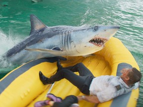 Aaron Eckhart battles a hungry shark in the new survival thriller 'Deep Water.'
