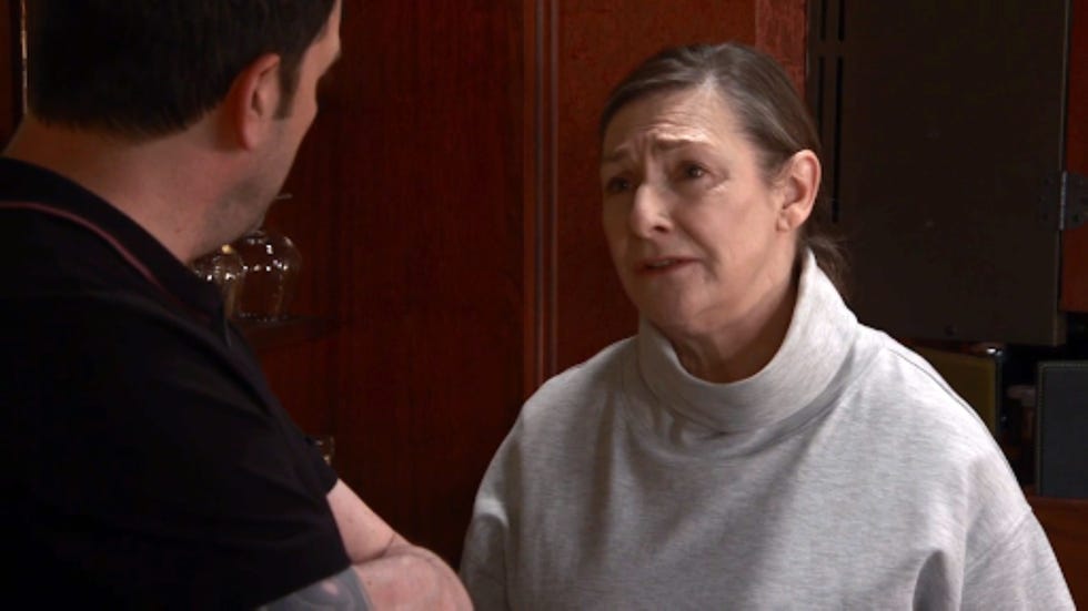 coronation street maggie driscoll conversation between two individuals in a restaurant setting