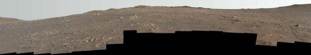 Perseverance created this enhanced-colour panorama of the Arbot area with 46 separate images. The rover's tracks can be seen receding into the background on the right. To the untrained eye, the image shows only plain rock and dust. But it's actually one of the most geologically rich regions in the rover's mission, and contains diverse types of rock. Image Credit: NASA/JPL-Caltech/ASU/MSSS
