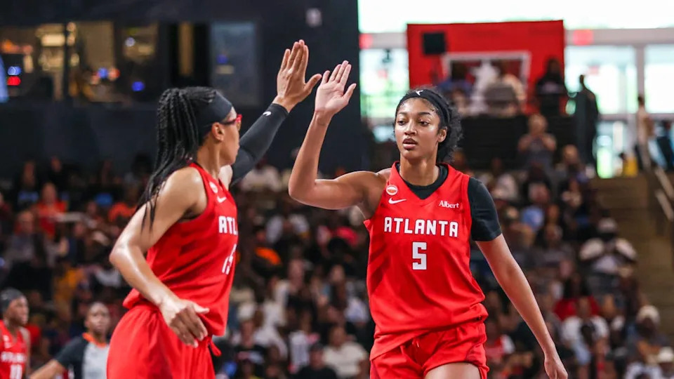 Atlanta Dream guard Allisha Gray gives forward Angel Reese a high five during gameJordan Godfree-Imagn Images