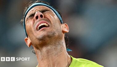 Rafael Nadal winces in pain.