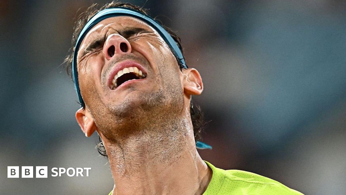 Rafael Nadal winces in pain.