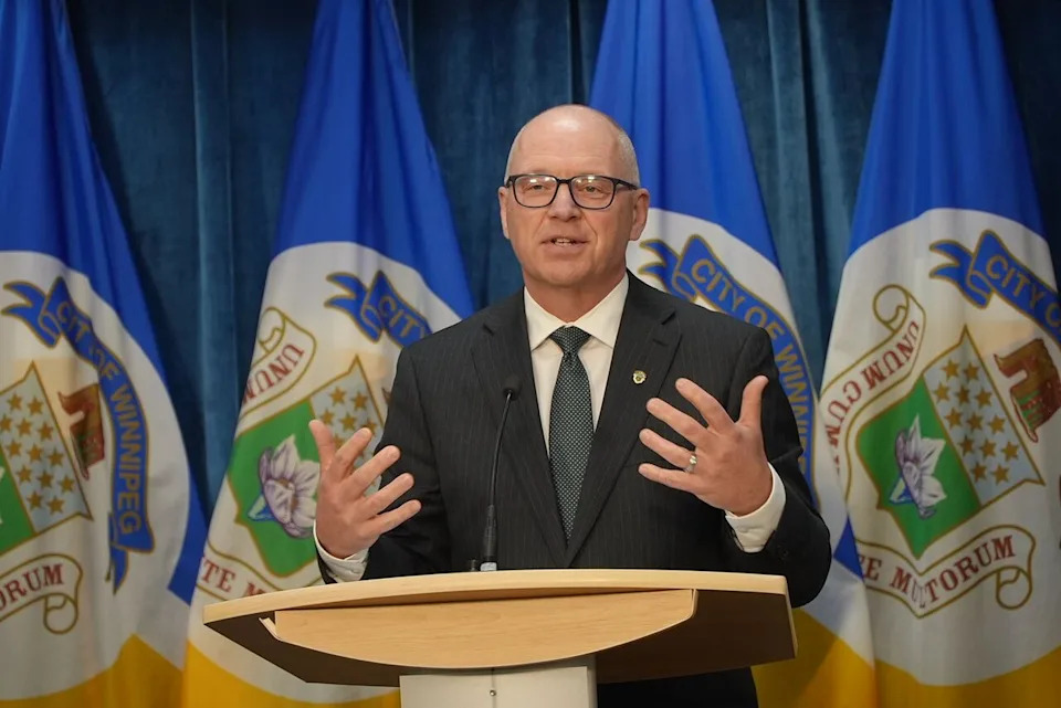 Winnipeg Mayor Scott Gillingham speaks with the media in front of a podium after an Executive Policy Committee meeting on May 19, 2026.