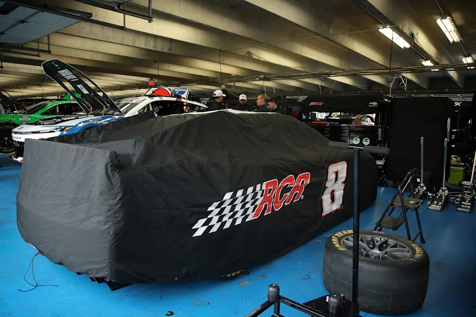 Jonathan Bachman/Getty Images - PHOTO: The car that will be driven by Austin Hill after the passing of Kyle Busch, sits covered in the garage area prior to practice for the NASCAR Cup Series Coca-Cola 600 at Charlotte Motor Speedway, on May 23, 2026, in Concord, North Carolina.