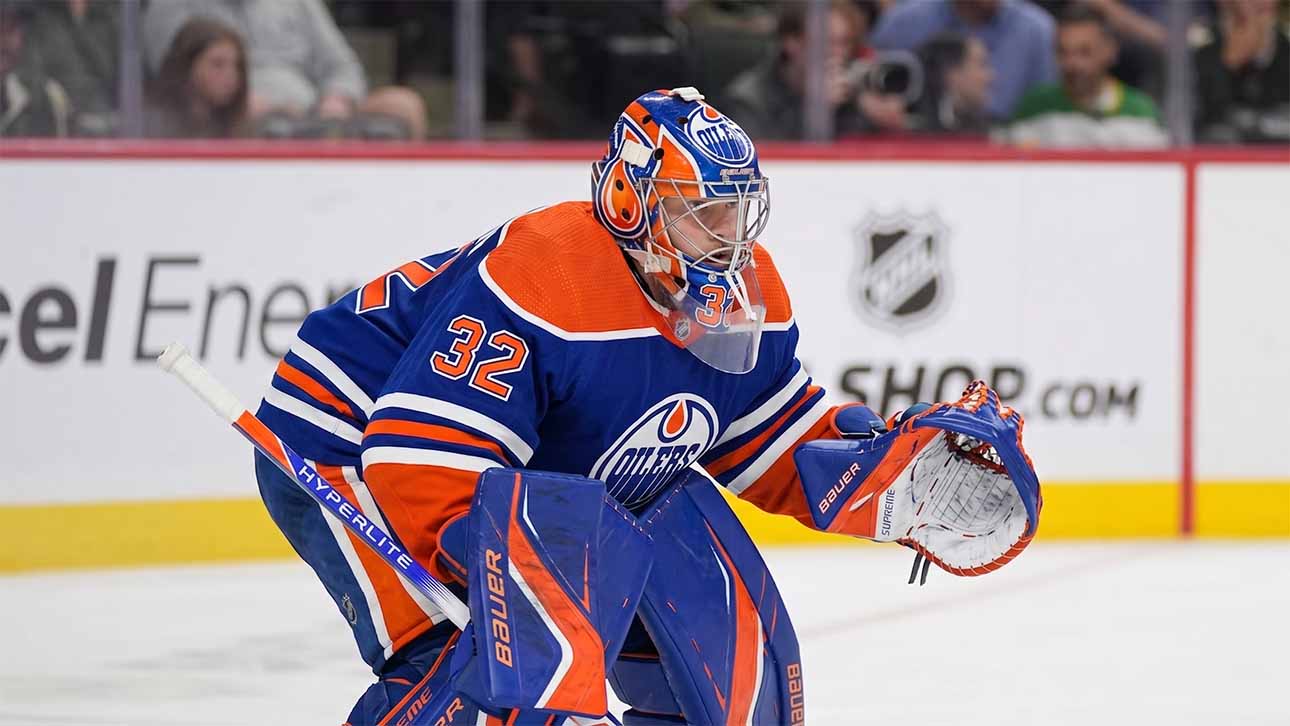 A conceptual photograph visualizing goaltender Filip Gustavsson wearing a royal blue and orange Edmonton Oilers uniform with number 32, representing the rumored NHL trade from the Minnesota Wild.