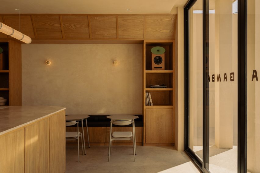 The front of a cafe including a bar area and further seating