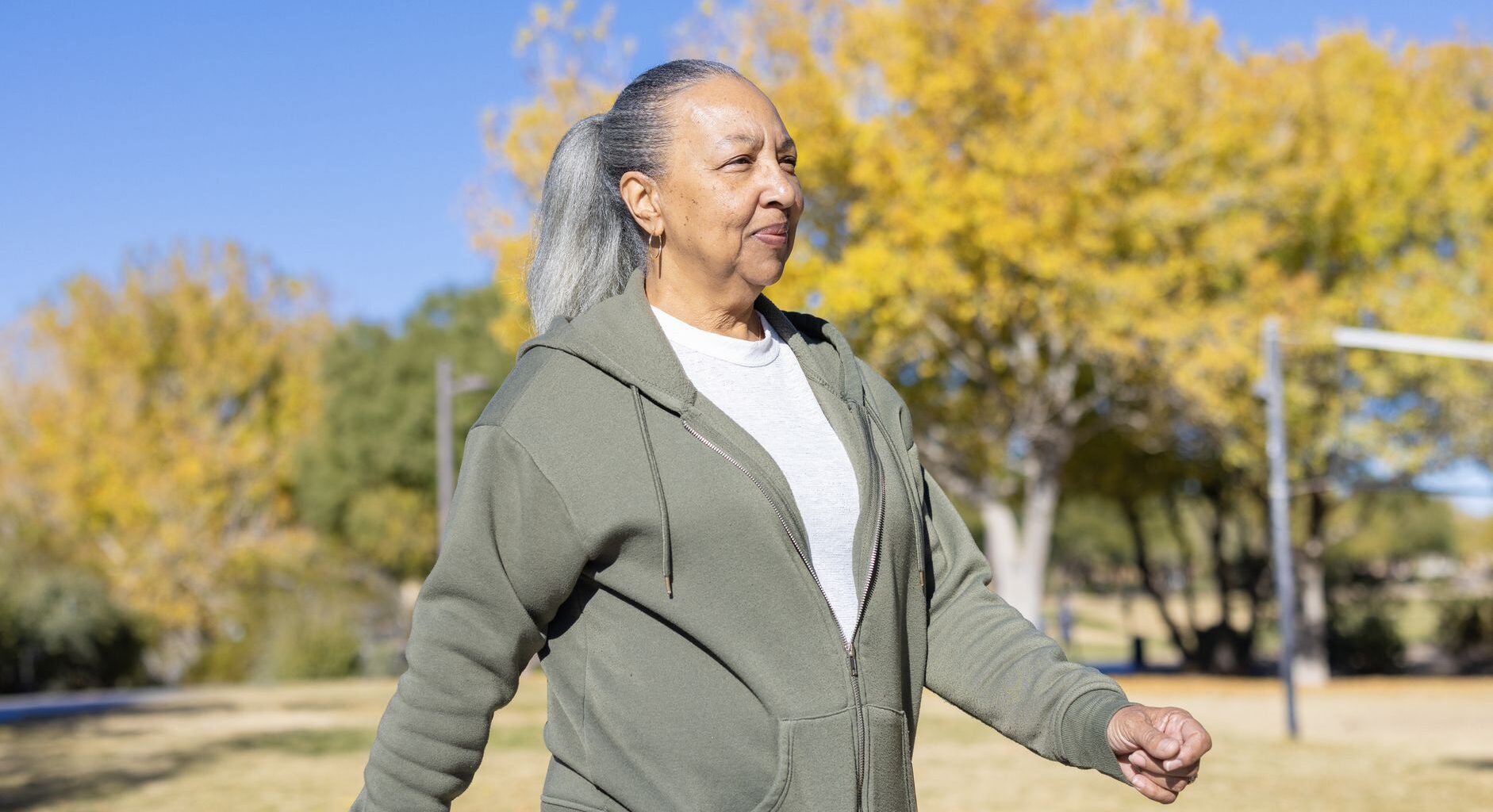 Senior woman walking outside