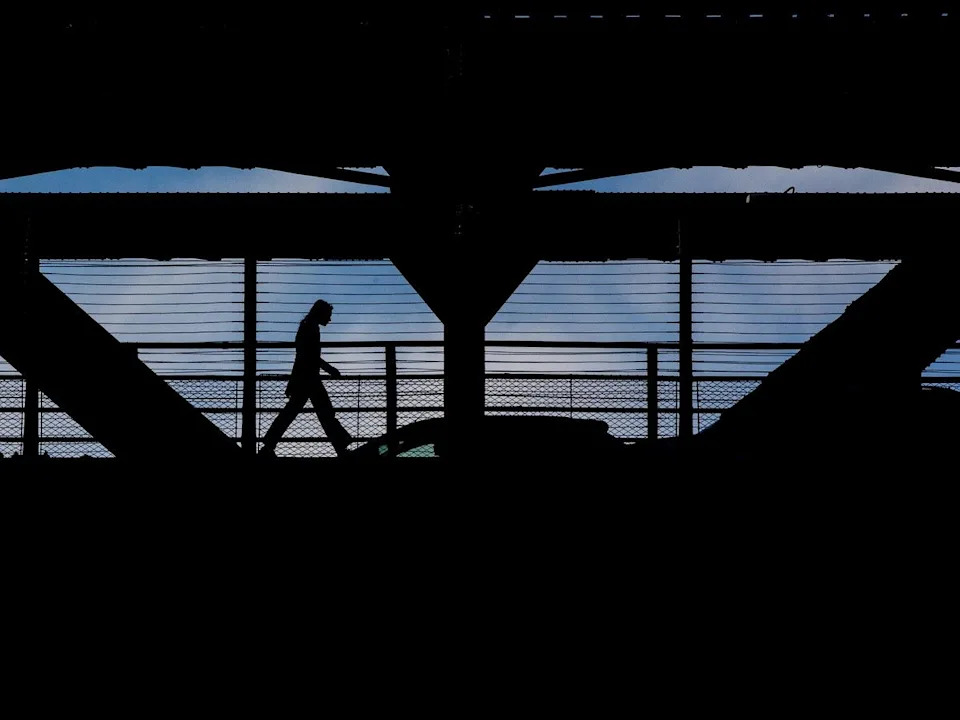A pedestrian crosses Edmonton’s High Level Bridge, Monday March 9, 2026. David Bloom-Postmedia