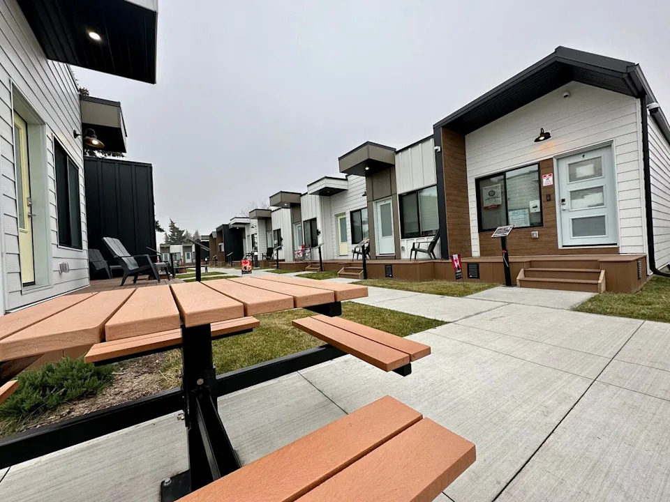 Picnic tables, a village garden and landscape on the grounds of the veteran village in Edmonton. 