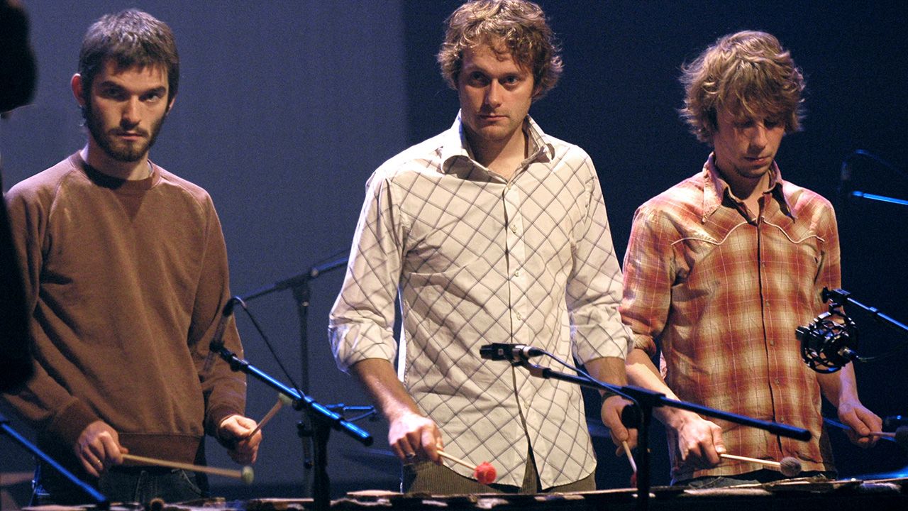 Kjartan Sveinsson (L), Georg Holm (C) and Orri Pall Dyrason (R) of Sigur R&oacute;s during a rehearsal of Odin's Raven Magic in Paris, 28 September 2004. (Photo by MAXIMILIEN LAMY / AFP)