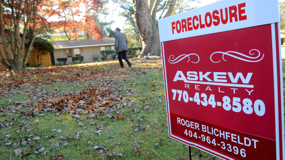 A foreclosure sign sits in front of a home in Sandy Springs, Georgia.