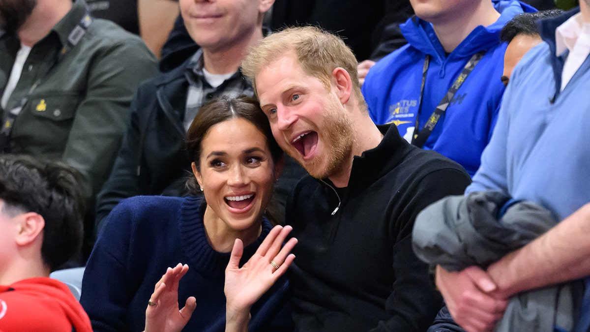 Meghan, Duchess of Sussex and Prince Harry, Duke of Sussex making funny faces at wheelchair basketball event