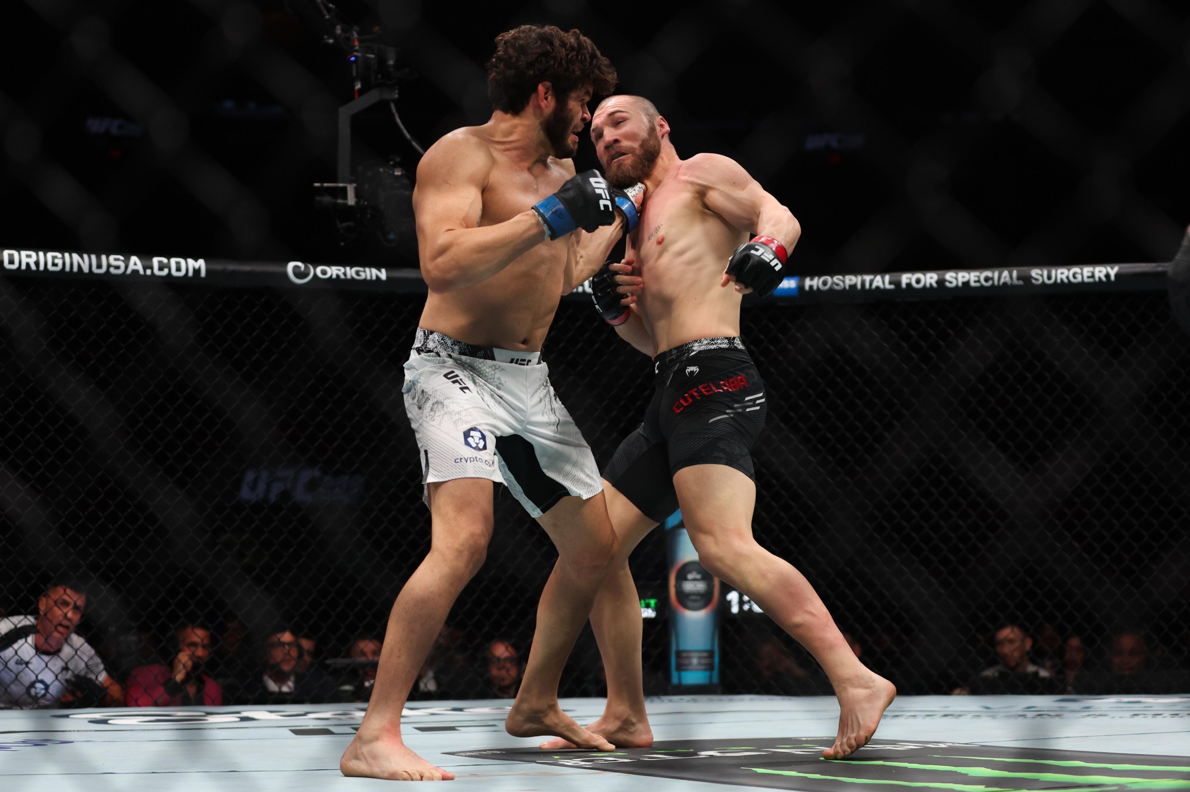 MIAMI, FLORIDA - MARCH 09: Philipe Lins of Brazil punches Ion Cutelaba of Moldova during their light heavyweight bout at UFC 299 at Kaseya Center on March 09, 2024 in Miami, Florida. (Photo by Megan Briggs/Getty Images)