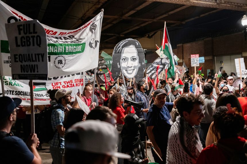 Pro-Palestinian protesters march in the street near the United Center in Chicago, where the Democratic National Convention is being held, on August 22, 2024.