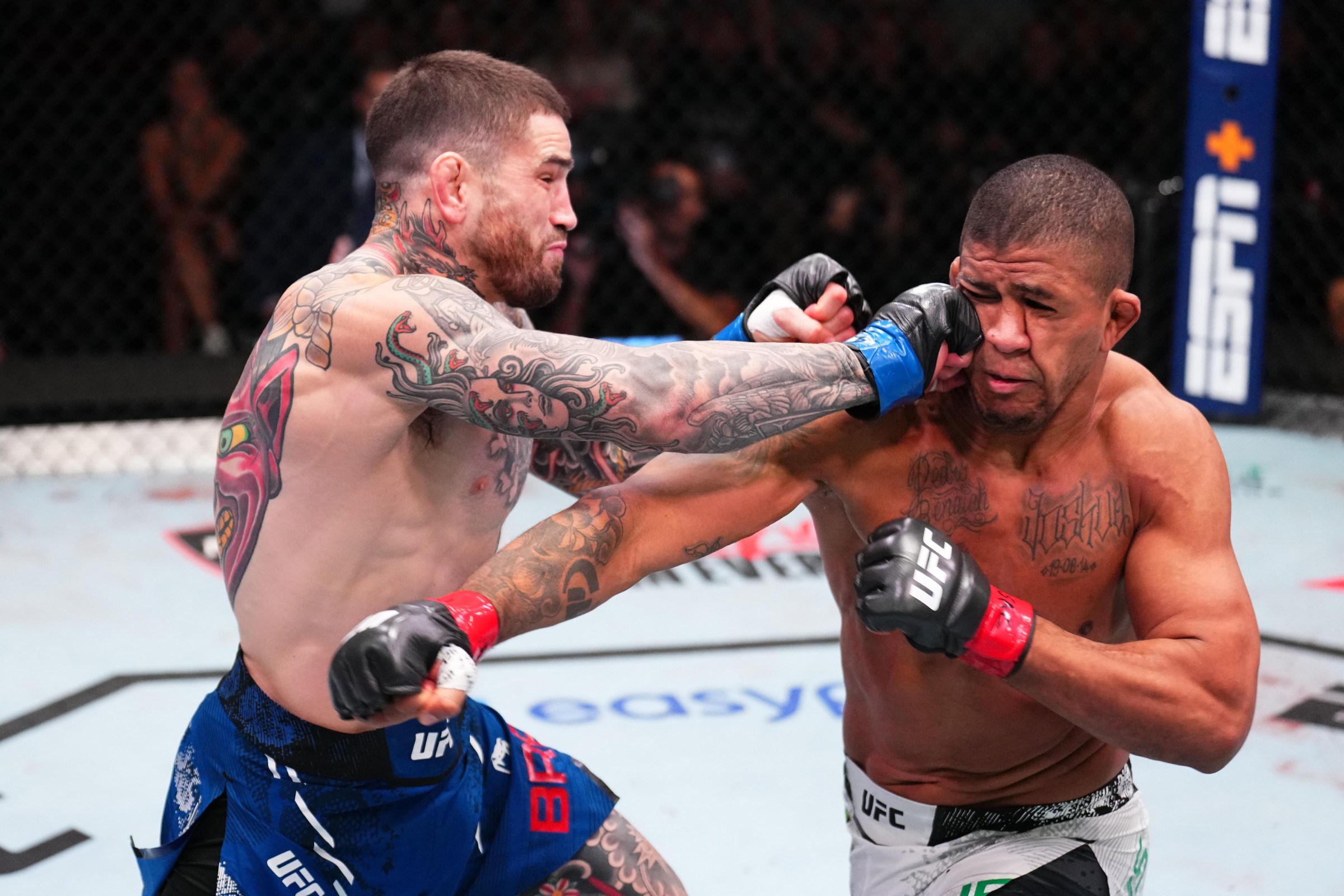 LAS VEGAS, NEVADA - SEPTEMBER 07: (L-R) Sean Brady punches Gilbert Burns of Brazil in a welterweight fight during the UFC Fight Night event at UFC APEX on September 07, 2024 in Las Vegas, Nevada. (Photo by Chris Unger/Zuffa LLC via Getty Images)