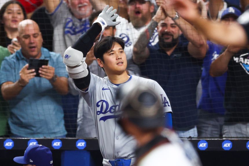Shohei Ohtani celebrates after hitting a two-run home run, his 50th of the season, during the seventh inning against the Miami Marlins at loanDepot park on September 19, 2024.