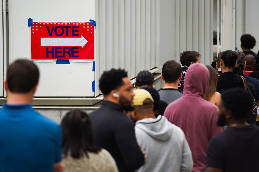 Voters head into a polling location in Atlanta on November 1, 2024, during early voting.