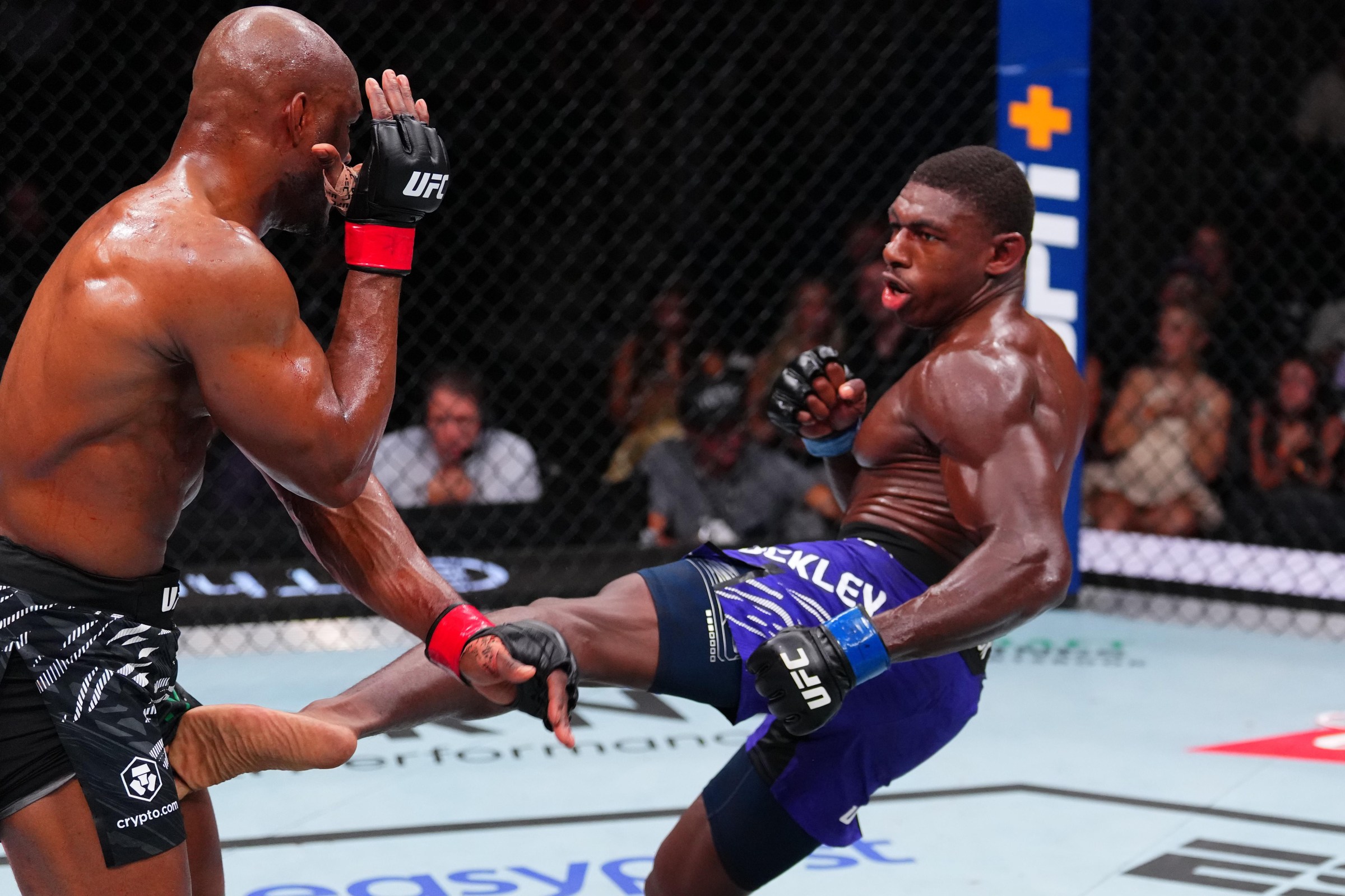 ATLANTA, GEORGIA - JUNE 14: (R-L) Joaquin Buckley kicks Kamaru Usman of Nigeria in a welterweight bout during the UFC Fight Night event at State Farm Arena on June 14, 2025 in Atlanta, Georgia. (Photo by Cooper Neill/Zuffa LLC)
