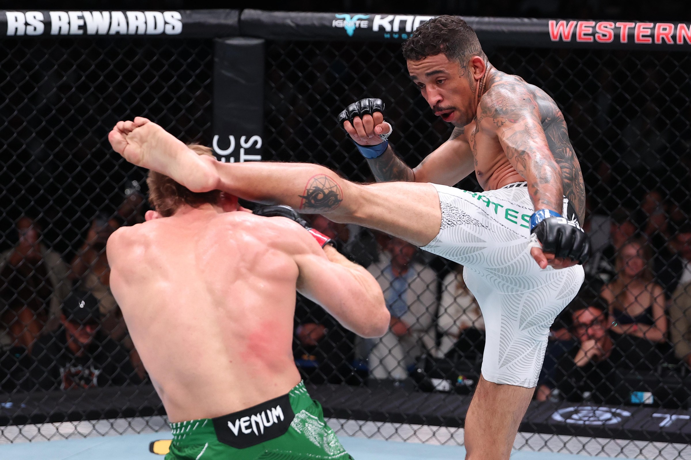 PERTH, AUSTRALIA - MAY 02: (R-L) Carlos Prates of Brazil kicks Jack Della Maddalena of Australia in a welterweight fight during the UFC Fight Night event at RAC Arena on May 02, 2026 in Perth, Australia. (Photo by Ed Mulholland/Zuffa LLC)