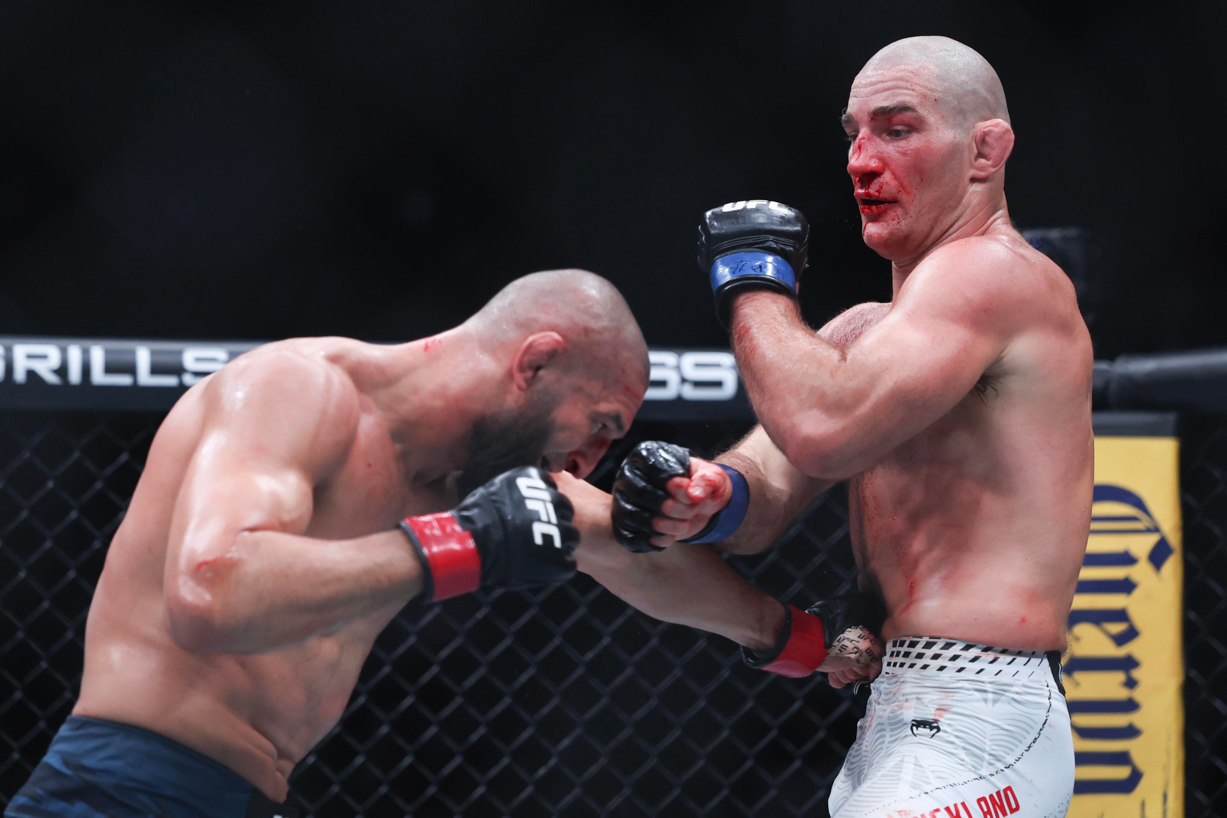 NEWARK, NEW JERSEY - MAY 09: Sean Strickland of the United States, (R), punches Khamzat Chimaev of the United Arab Emirates in a middleweight title bout during UFC 328 at the Prudential Center on May 09, 2026 in Newark, New Jersey. (Photo by Ishika Samant/Getty Images)