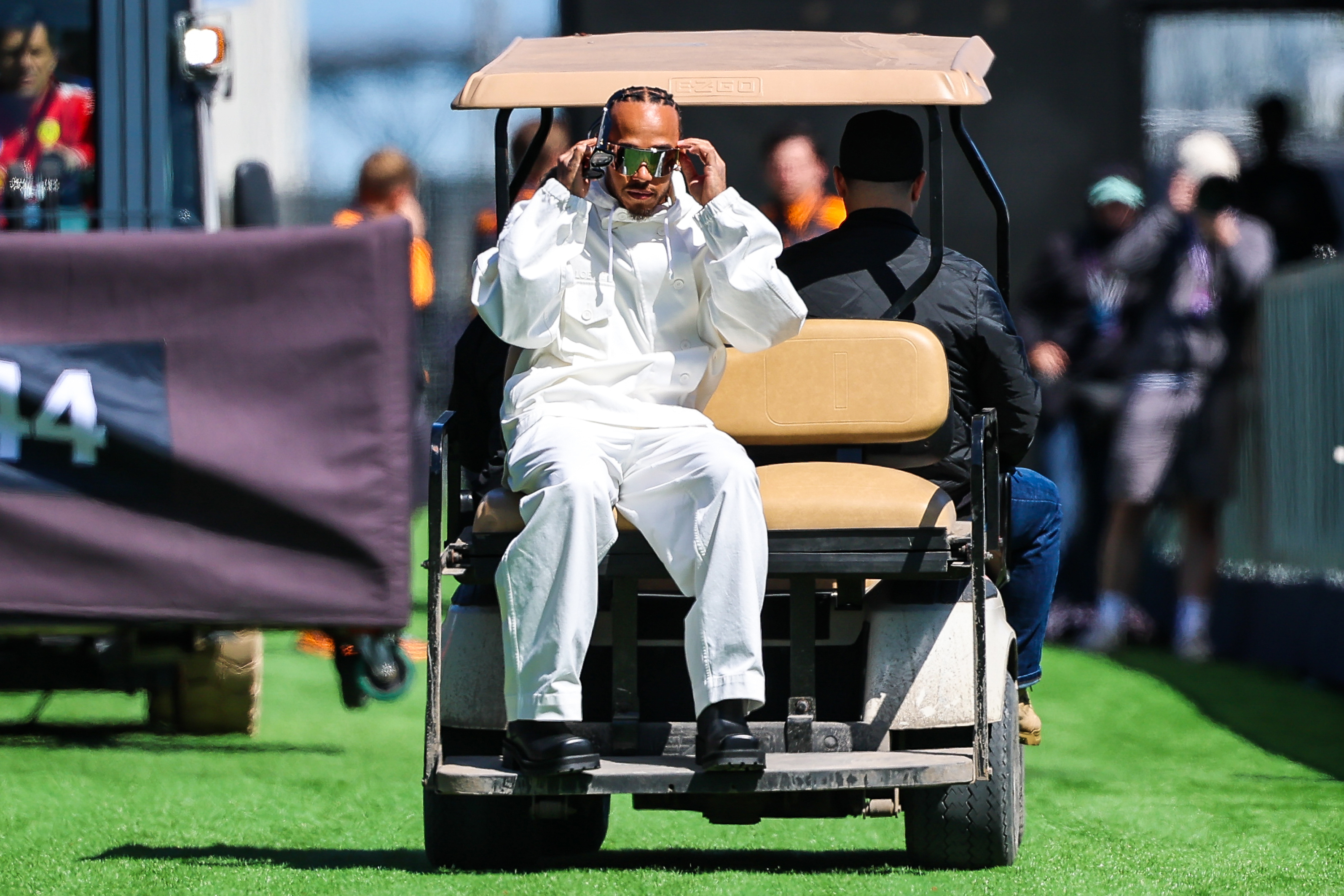 MONTREAL, CANADA - MAY 21: Lewis Hamilton of Great Britain and Scuderia Ferrari travels through the paddock on a buggy during previews ahead of the F1 Grand Prix of Canada at Circuit Gilles-Villeneuve on May 21, 2026 in Montreal, Canada. (Photo by Kym Illman/Getty Images)