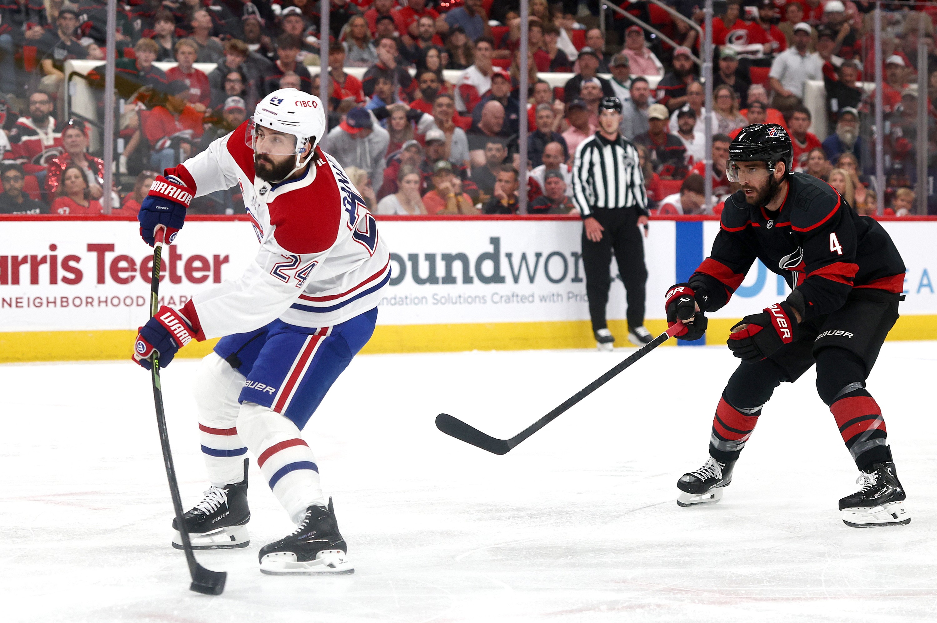 Canadiens' Phillip Danault shoots to score a goal against the Hurricanes.