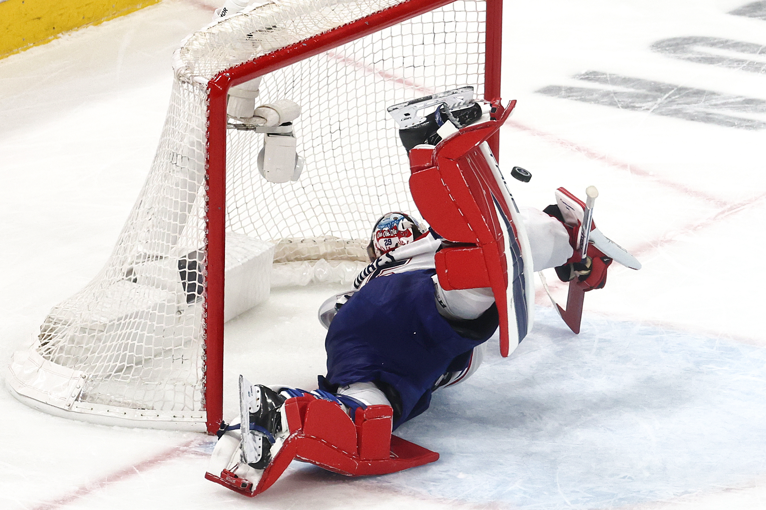 Canadiens' Jakub Dobes dives in effort to make a save during third period Saturday night in Raleigh, N.C.