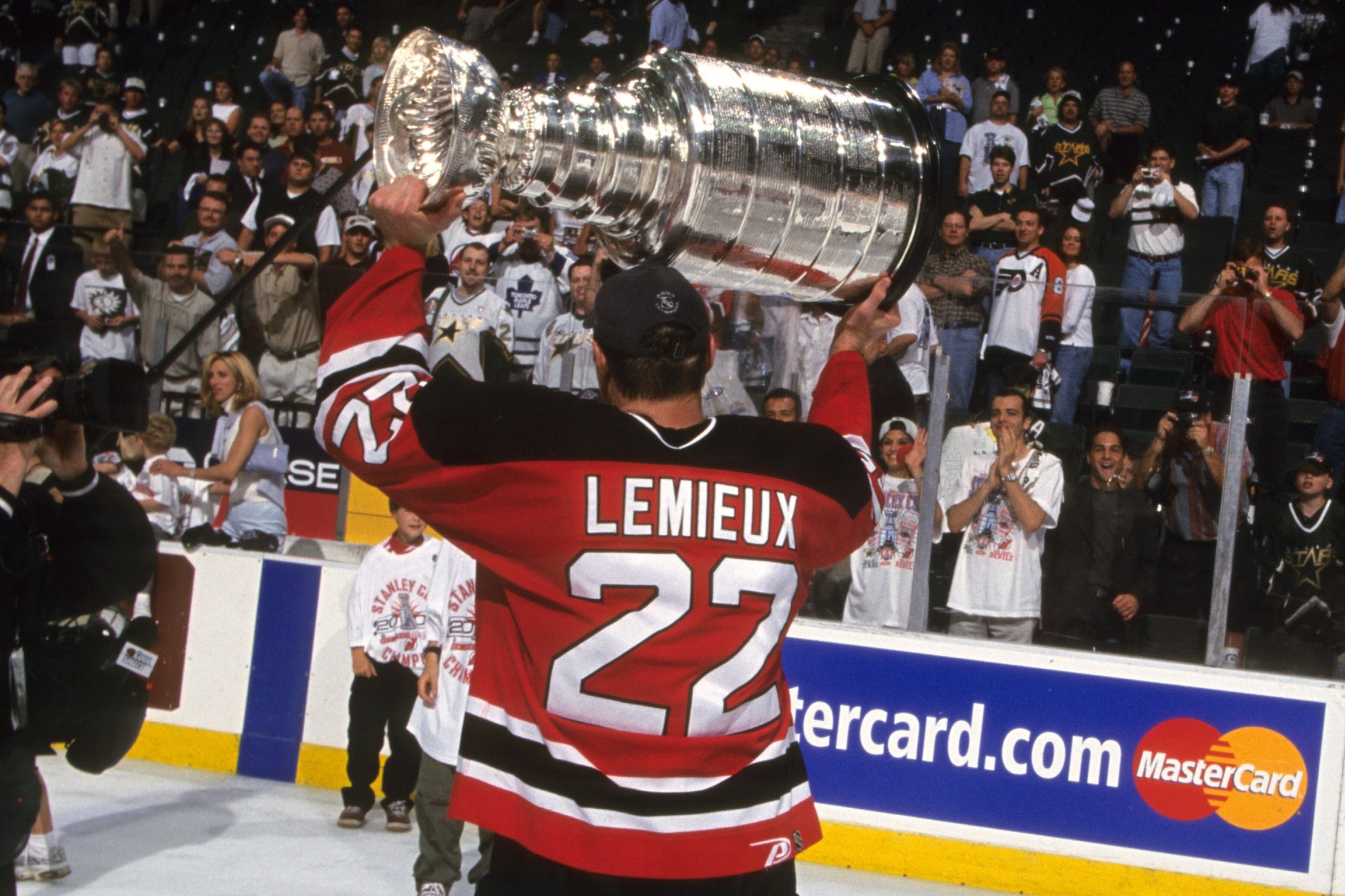 Claude Lemieux holds up the Stanley Cup.