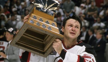 Claude Lemieux in a Devils jersey with the Conn Smythe trophy.
