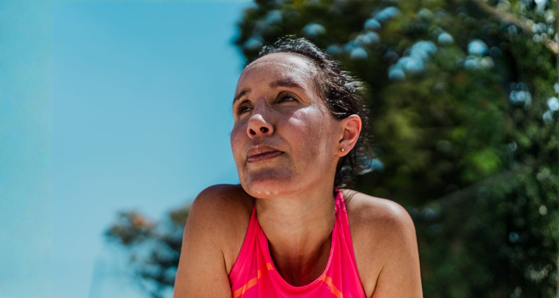 Tired mature woman sweating during sports activity
