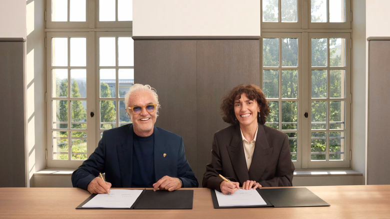 Alpine Executive Advisor Flavio Briatore and Francesca Bellettini, President and Chief Executive Officer of Gucci