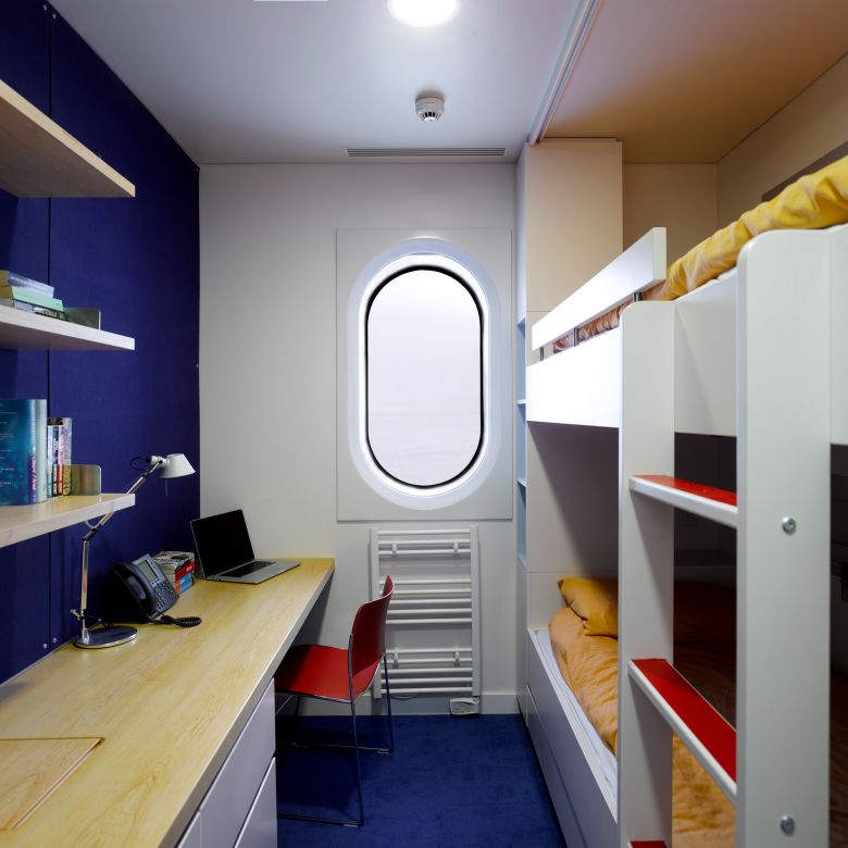A brightly colored bedroom at the Halley VI British Antarctic Research Station.