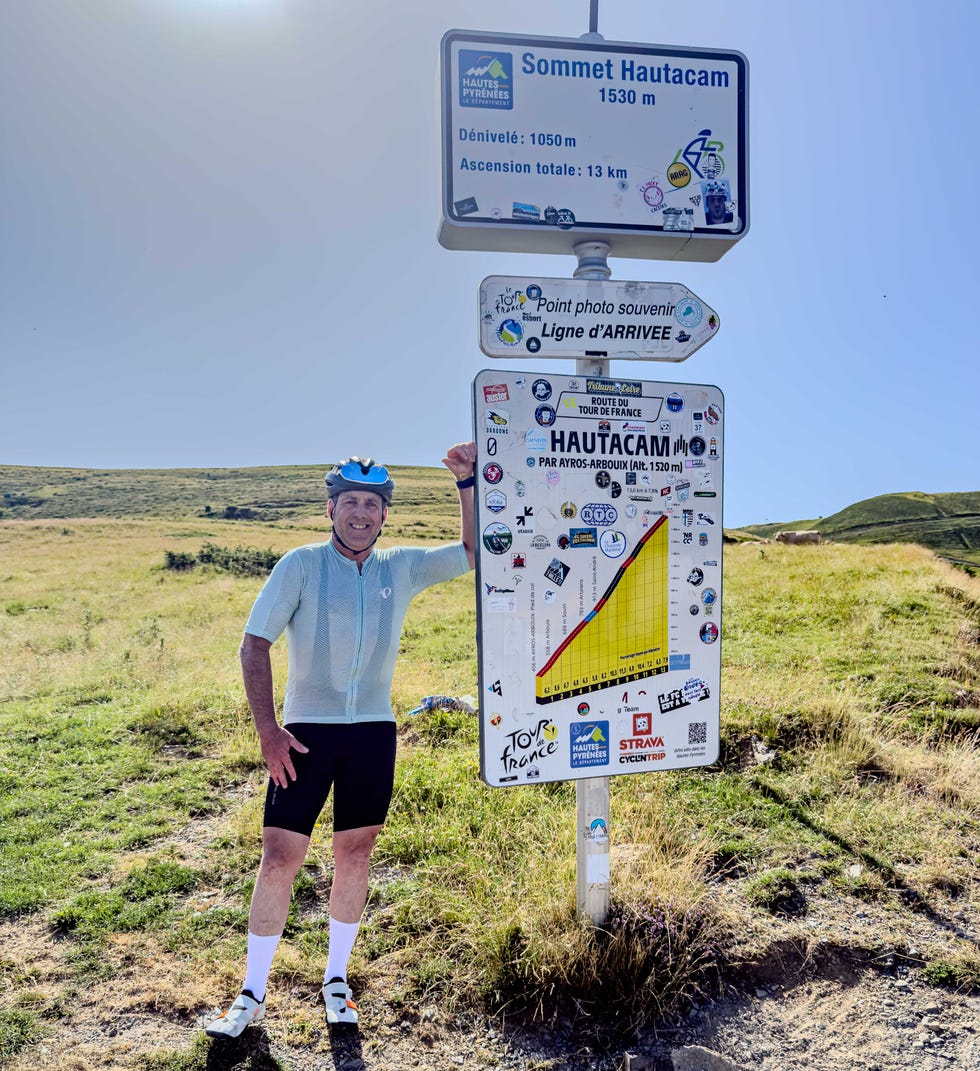 cyclist smiling at the hautacam summit
