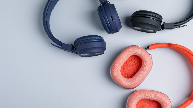 A number of wireless headphones in various colors