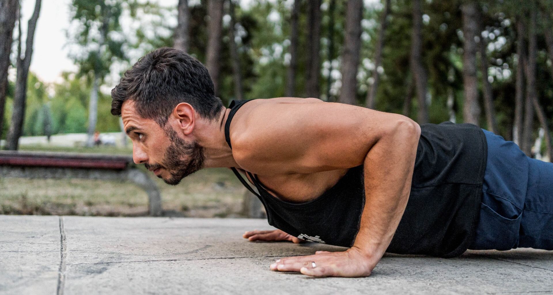 A man performing a hand release push up