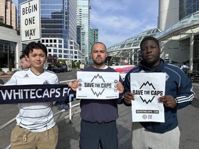 Anthony Hondier, Nicolas Hondier and Nehemiah Kusopila outside Canada Place following Thursday's Save the Caps protest near the FIFA Congress.