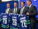 From left, Henrik Sedin, Daniel Sedin, Francesco Aquilini and Ryan Johnson. 