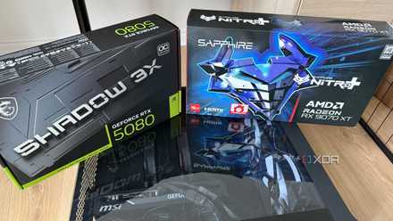 A photo of two GPU boxes on top of a PC build