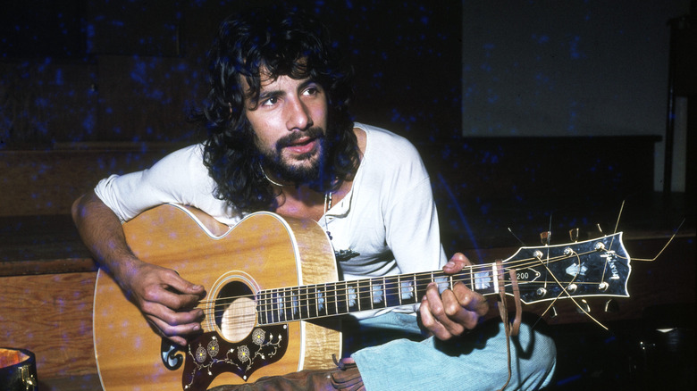folk singer Cat Stevens with guitar