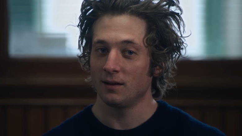 Carmy Berzatto standing with his hair disheveled