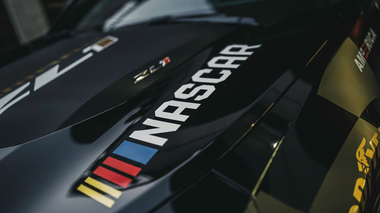 Picture showing the NASCAR logo painted onto the hood of a race car