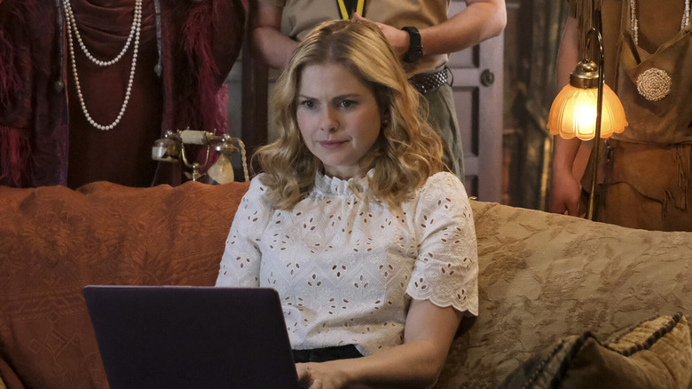 Rose McIver as Samantha using a laptop in Ghosts