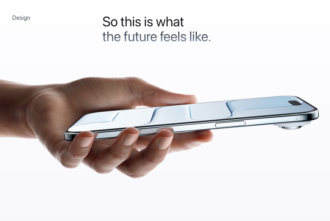 Hand holding a sleek, reflective smartphone horizontally against a white background, symbolizing future design.