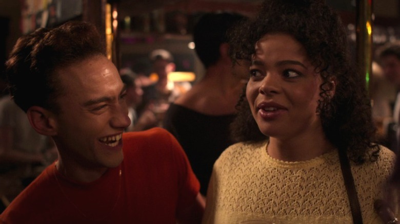 Ritchie (Olly Alexander) and Jill (Lydia West) laughing on It's a Sin S1E1