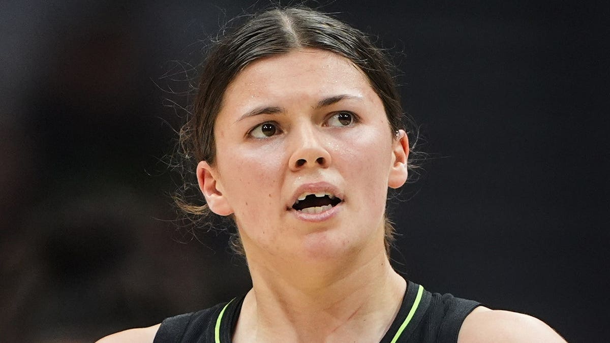 Seattle Storm guard Jade Melbourne looking on after chipping a tooth during a basketball game