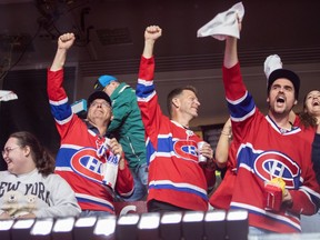 Fans at a Bell Centre viewing party celebrate a first period goal during game 7 between the Montreal Canadiens and the Buffalo Sabres in the second round of the Stanley Cup Playoffs Monday, May 18, 2026. The game was being played in Buffalo, New York.